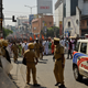 Policemen stand guard during a march by BJP activists in Thiruvananthapuram, Kerala’s capital.